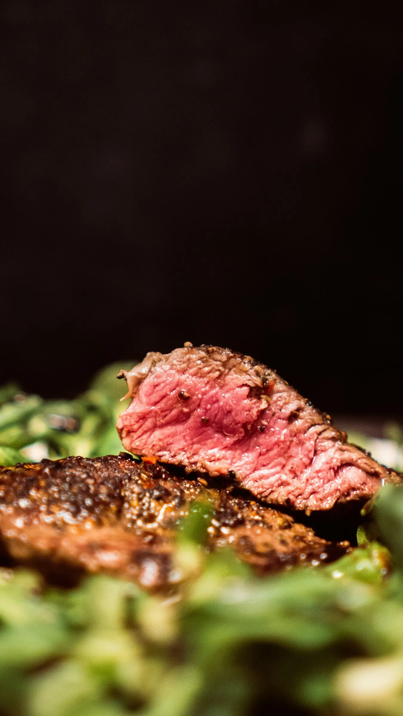 Sliced grilled steak with herbs